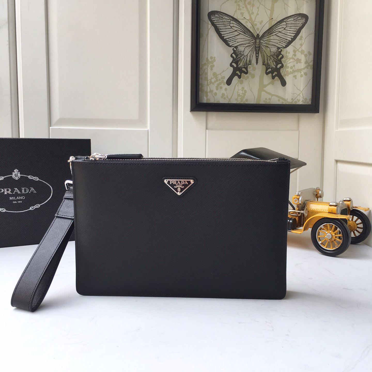 Pra*a clutch bags